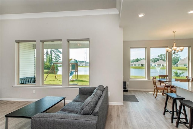 40262 Sedgwick Ln, Ponchatoula, LA 70454 - living area featuring a chandelier, light wood-type flooring, a water view, and recessed lighting