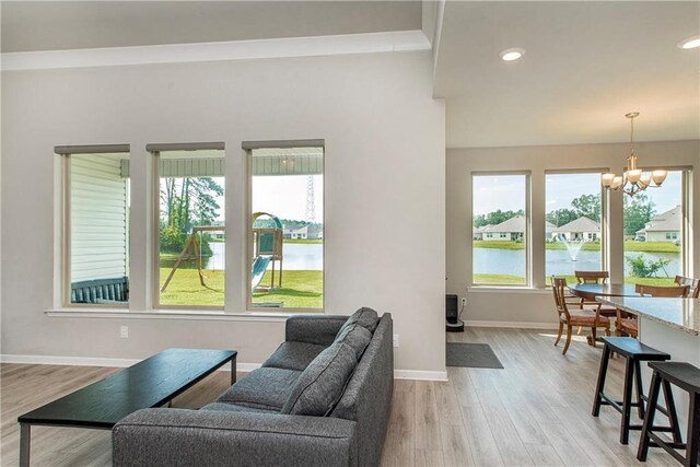 40262 Sedgwick Ln, Ponchatoula, LA 70454 - living area featuring a chandelier, light wood-type flooring, a water view, and recessed lighting