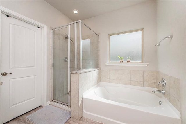 40262 Sedgwick Ln, Ponchatoula, LA 70454 - full bath featuring a bath, a shower stall, and wood finished floors