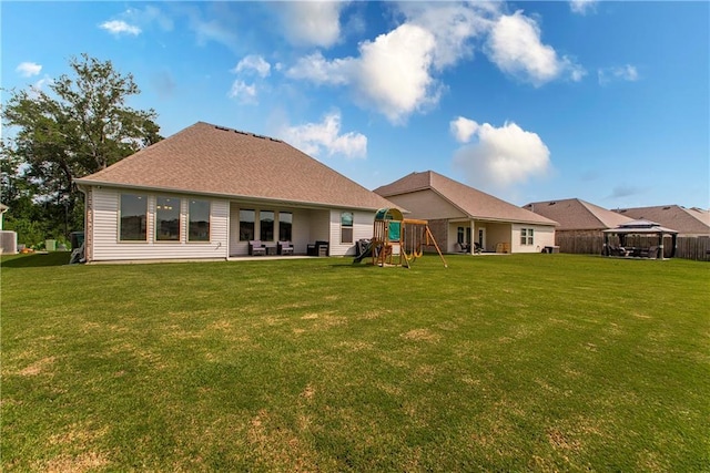 40262 Sedgwick Ln, Ponchatoula, LA 70454 - back of property featuring a playground, a yard, and a gazebo