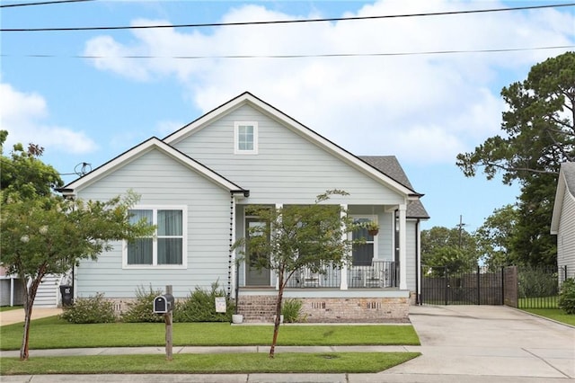 1908 Alexander Ave, Arabi, LA 70032 - bungalow-style house featuring a porch and driveway