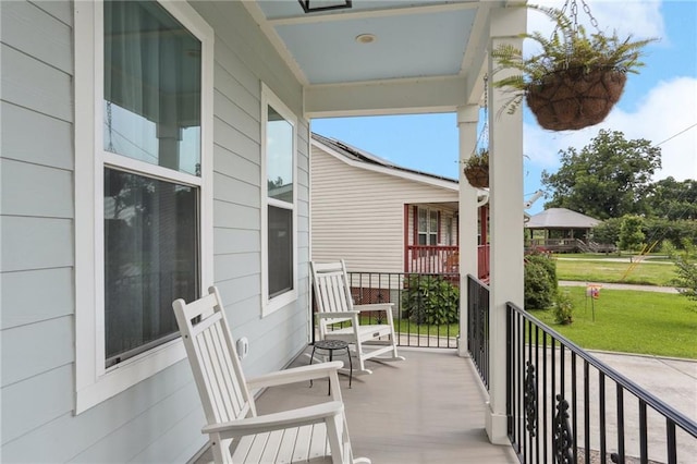 1908 Alexander Ave, Arabi, LA 70032 - porch featuring a yard