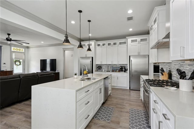 1908 Alexander Ave, Arabi, LA 70032 - kitchen featuring stainless steel appliances, a sink, decorative backsplash, ceiling fan, and light countertops