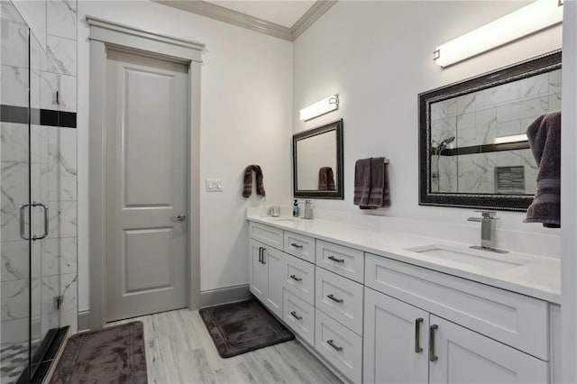 1908 Alexander Ave, Arabi, LA 70032 - full bath with crown molding, a marble finish shower, double vanity, wood finished floors, and baseboards