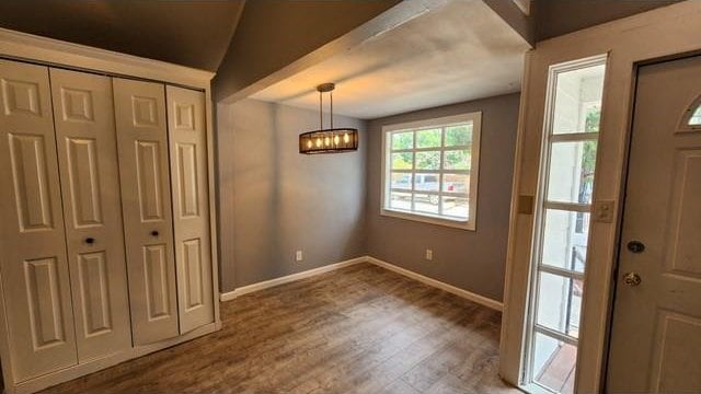 146 Elodie Ave, Harahan, LA 70123 - foyer entrance with a chandelier, baseboards, and wood finished floors