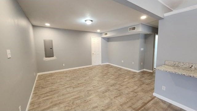 146 Elodie Ave, Harahan, LA 70123 - finished basement featuring recessed lighting, baseboards, wood finished floors, and electric panel