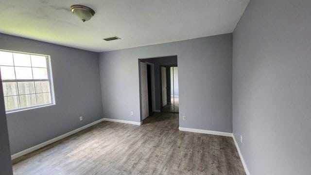 146 Elodie Ave, Harahan, LA 70123 - empty room with wood finished floors and baseboards