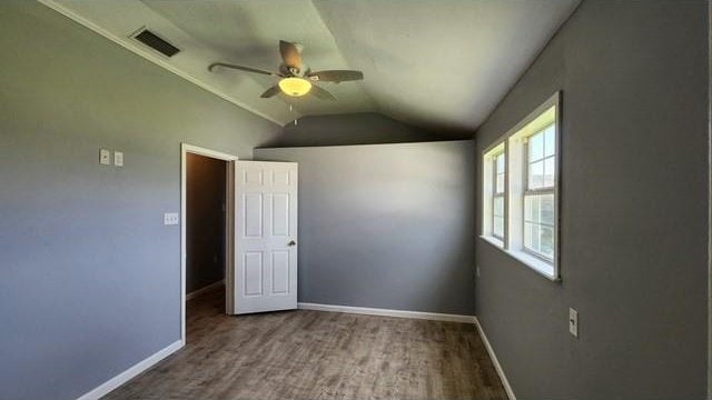 146 Elodie Ave, Harahan, LA 70123 - empty room featuring a ceiling fan, lofted ceiling, baseboards, and wood finished floors