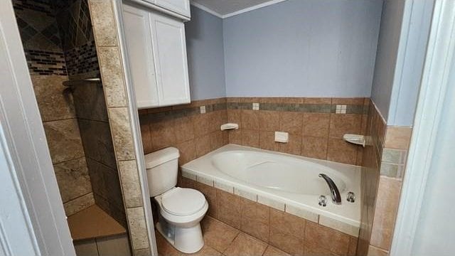 146 Elodie Ave, Harahan, LA 70123 - full bath with toilet, a garden tub, crown molding, tiled shower, and tile patterned flooring