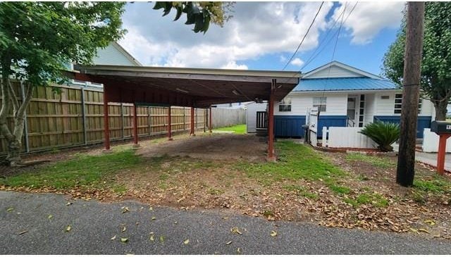 146 Elodie Ave, Harahan, LA 70123 - view of parking featuring an attached carport