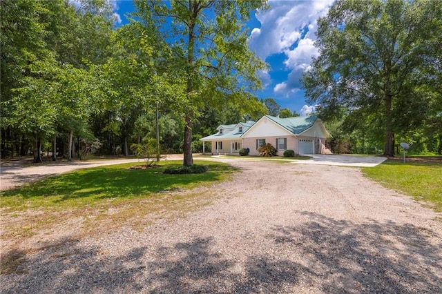 39311 Okefenokee Rd, Pearl River, LA 70452 - ranch-style house with driveway and an attached garage