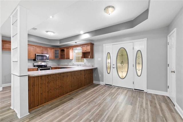 39311 Okefenokee Rd, Pearl River, LA 70452 - kitchen featuring stainless steel appliances, light wood-style flooring, and baseboards