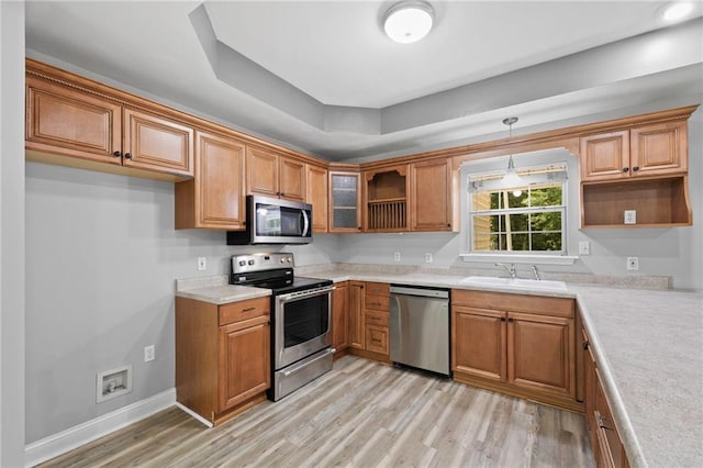 39311 Okefenokee Rd, Pearl River, LA 70452 - kitchen with stainless steel appliances, open shelves, a sink, and brown cabinets