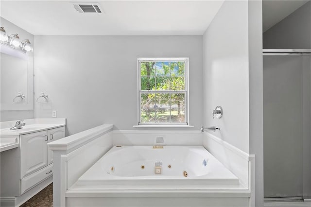 39311 Okefenokee Rd, Pearl River, LA 70452 - full bath featuring vanity, a jetted tub, and a stall shower