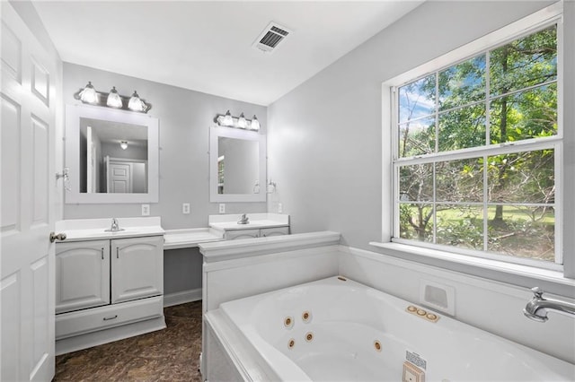 39311 Okefenokee Rd, Pearl River, LA 70452 - full bath with healthy amount of natural light, vanity, and a tub with jets