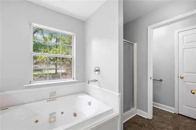 39311 Okefenokee Rd, Pearl River, LA 70452 - full bath featuring plenty of natural light, a stall shower, a whirlpool tub, and baseboards