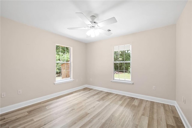 39311 Okefenokee Rd, Pearl River, LA 70452 - unfurnished room featuring light wood-type flooring, baseboards, and a ceiling fan