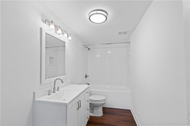 7033 Wuerpel St, New Orleans, LA 70124 - bathroom with vanity, toilet, wood finished floors, and bathtub / shower combination