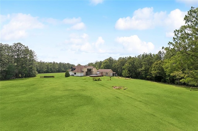404 Warrior Trce, Covington, LA 70435 - view of grassy yard with a wooded view