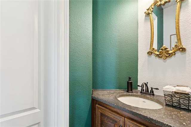404 Warrior Trce, Covington, LA 70435 - bathroom featuring vanity and a textured wall