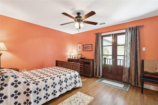 404 Warrior Trce, Covington, LA 70435 - bedroom featuring wood finished floors, access to outside, and ceiling fan