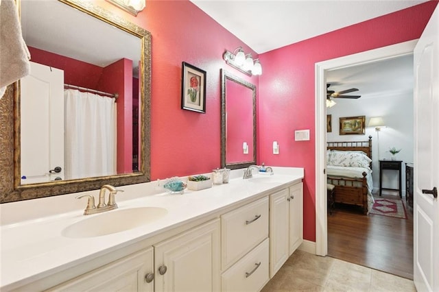 404 Warrior Trce, Covington, LA 70435 - ensuite bathroom featuring double vanity, ceiling fan, and tile patterned flooring