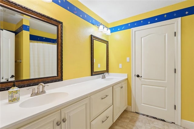 404 Warrior Trce, Covington, LA 70435 - full bathroom featuring double vanity and baseboards