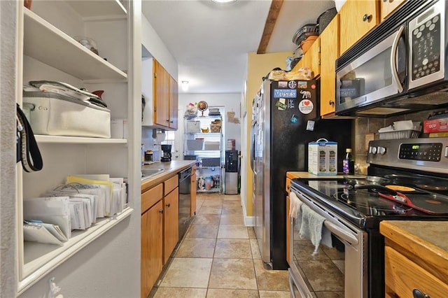 740 Heavens Dr Unit 2, Mandeville, LA 70471 - kitchen featuring stainless steel range with electric stovetop, dishwasher, light countertops, brown cabinetry, and light tile patterned floors