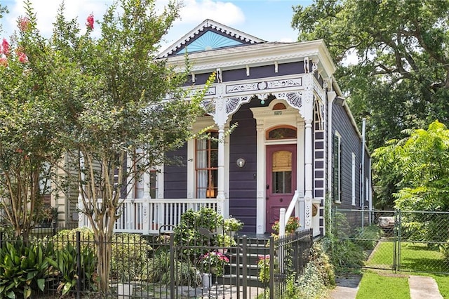 717 Nunez St, New Orleans, LA 70114 - view of front of home featuring a porch, a gate, and a fenced front yard