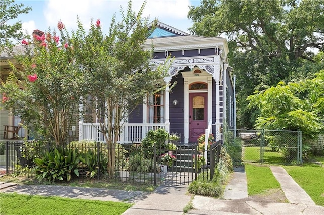 717 Nunez St, New Orleans, LA 70114 - view of front of property with a gate, a fenced front yard, and covered porch