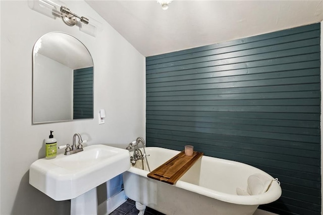 717 Nunez St, New Orleans, LA 70114 - bathroom featuring a freestanding bath and tile patterned floors