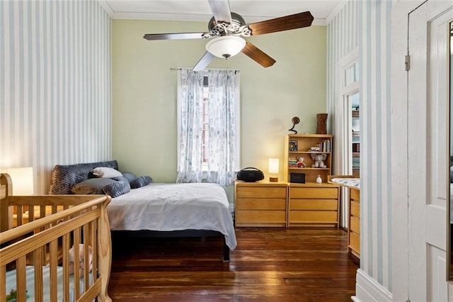 717 Nunez St, New Orleans, LA 70114 - bedroom featuring dark wood-style floors, ornamental molding, wallpapered walls, and ceiling fan