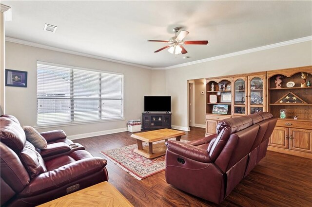 481 Scotch Pine Dr, Ponchatoula, LA 70454 - living area featuring ceiling fan, dark wood-style flooring, baseboards, and crown molding