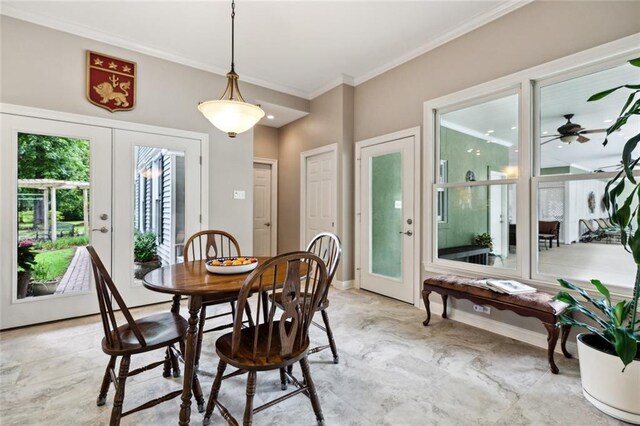 42532 S Range Rd, Hammond, LA 70403 - dining room featuring crown molding, ceiling fan, and baseboards