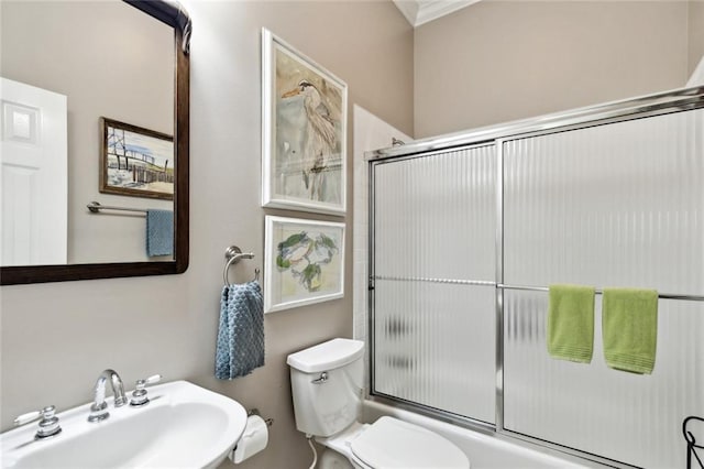 42532 S Range Rd, Hammond, LA 70403 - full bathroom featuring a sink, combined bath / shower with glass door, toilet, and crown molding