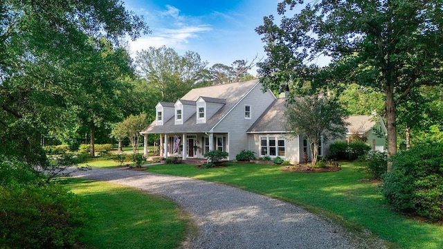 42532 S Range Rd, Hammond, LA 70403 - cape cod home with a porch, a front lawn, and gravel driveway