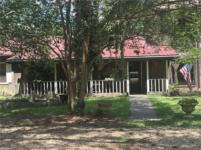 30010 River Rd, Mount Hermon, LA 70450 - view of front facade featuring covered porch and metal roof