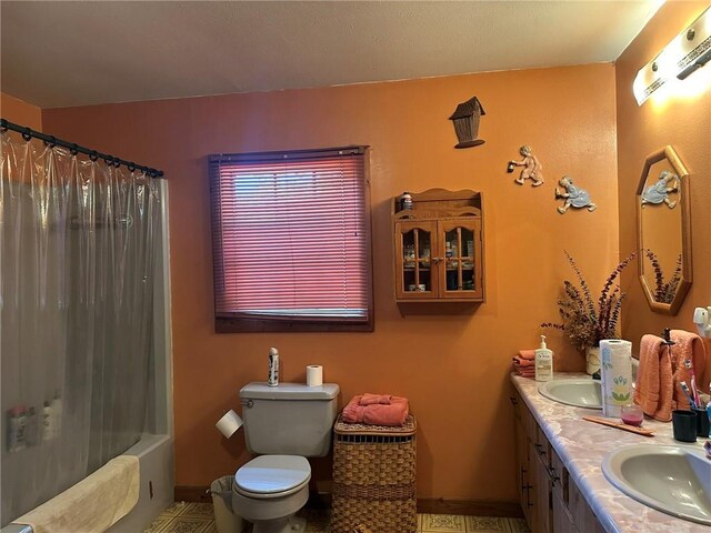 30010 River Rd, Mount Hermon, LA 70450 - bathroom featuring double vanity, toilet, shower / bath combination with curtain, and baseboards