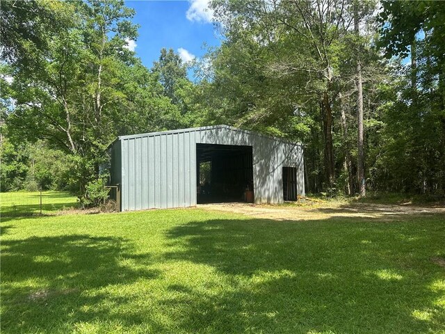 30010 River Rd, Mount Hermon, LA 70450 - view of pole building featuring a yard