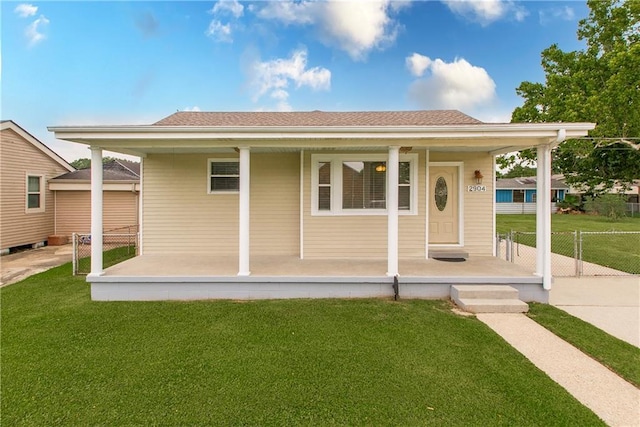 2904 Lloyds Ave, Chalmette, LA 70043 - view of front of house with covered porch and a front yard