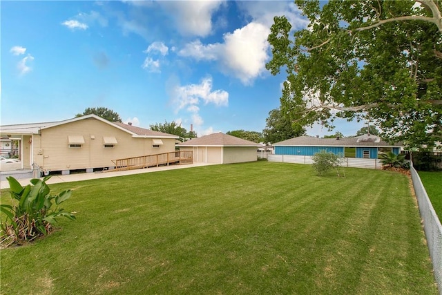 2904 Lloyds Ave, Chalmette, LA 70043 - view of green lawn with a wooden deck