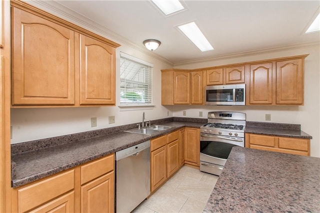 2904 Lloyds Ave, Chalmette, LA 70043 - kitchen featuring appliances with stainless steel finishes, a sink, crown molding, dark countertops, and light tile patterned floors