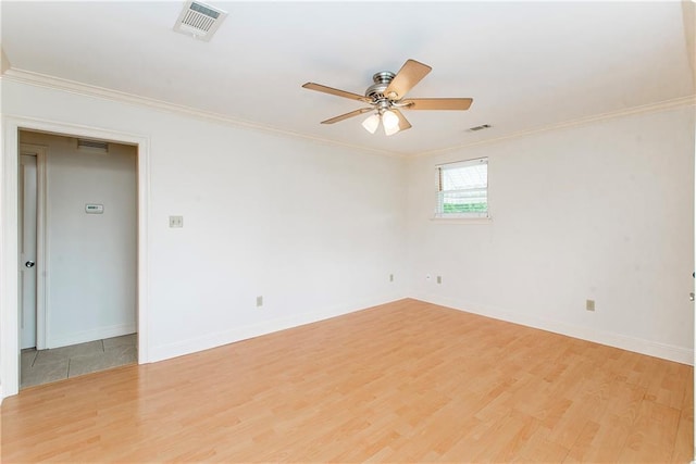 2904 Lloyds Ave, Chalmette, LA 70043 - empty room featuring light wood finished floors, ceiling fan, crown molding, and baseboards