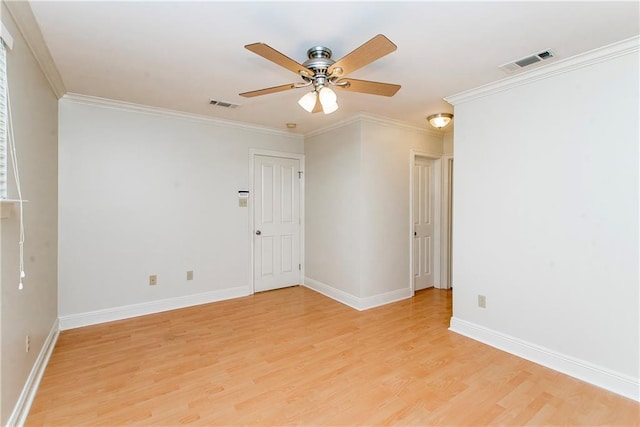 2904 Lloyds Ave, Chalmette, LA 70043 - spare room featuring light wood-style flooring, ornamental molding, baseboards, and ceiling fan