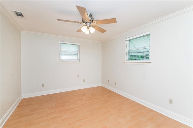 2904 Lloyds Ave, Chalmette, LA 70043 - spare room featuring light wood-type flooring, ceiling fan, baseboards, and crown molding