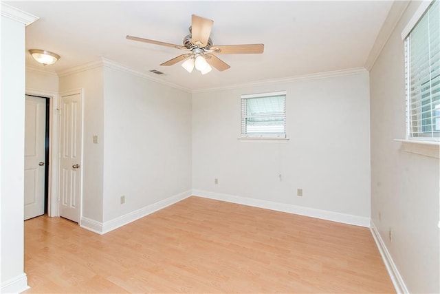 2904 Lloyds Ave, Chalmette, LA 70043 - unfurnished room featuring light wood-style flooring, a ceiling fan, crown molding, and baseboards