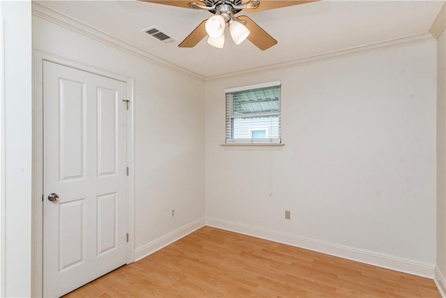 2904 Lloyds Ave, Chalmette, LA 70043 - empty room with light wood-style floors, a ceiling fan, baseboards, and ornamental molding