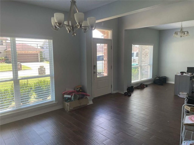 2133 Wellington Ln, Slidell, LA 70461 - entrance foyer featuring a chandelier, baseboards, and dark wood-type flooring