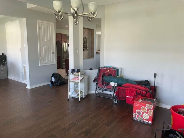 2133 Wellington Ln, Slidell, LA 70461 - dining space featuring baseboards, wood finished floors, and a chandelier