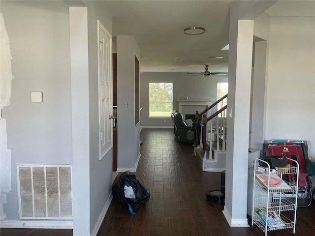 2133 Wellington Ln, Slidell, LA 70461 - hallway featuring baseboards, wood finished floors, and stairs
